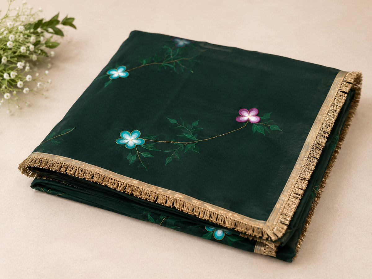 Folded dark green Darwani gota chiffon saree with floral detailing and golden border