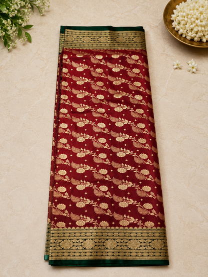 Deep Maroon Banarasi Silk Saree flat lay showing all-over gold zari floral and paisley weave design
