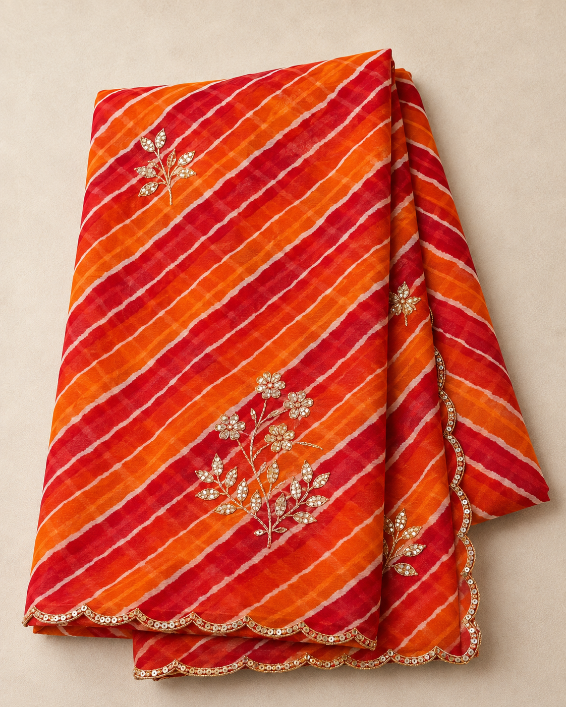 Orange and red lehariya georgette saree - folded flat lay