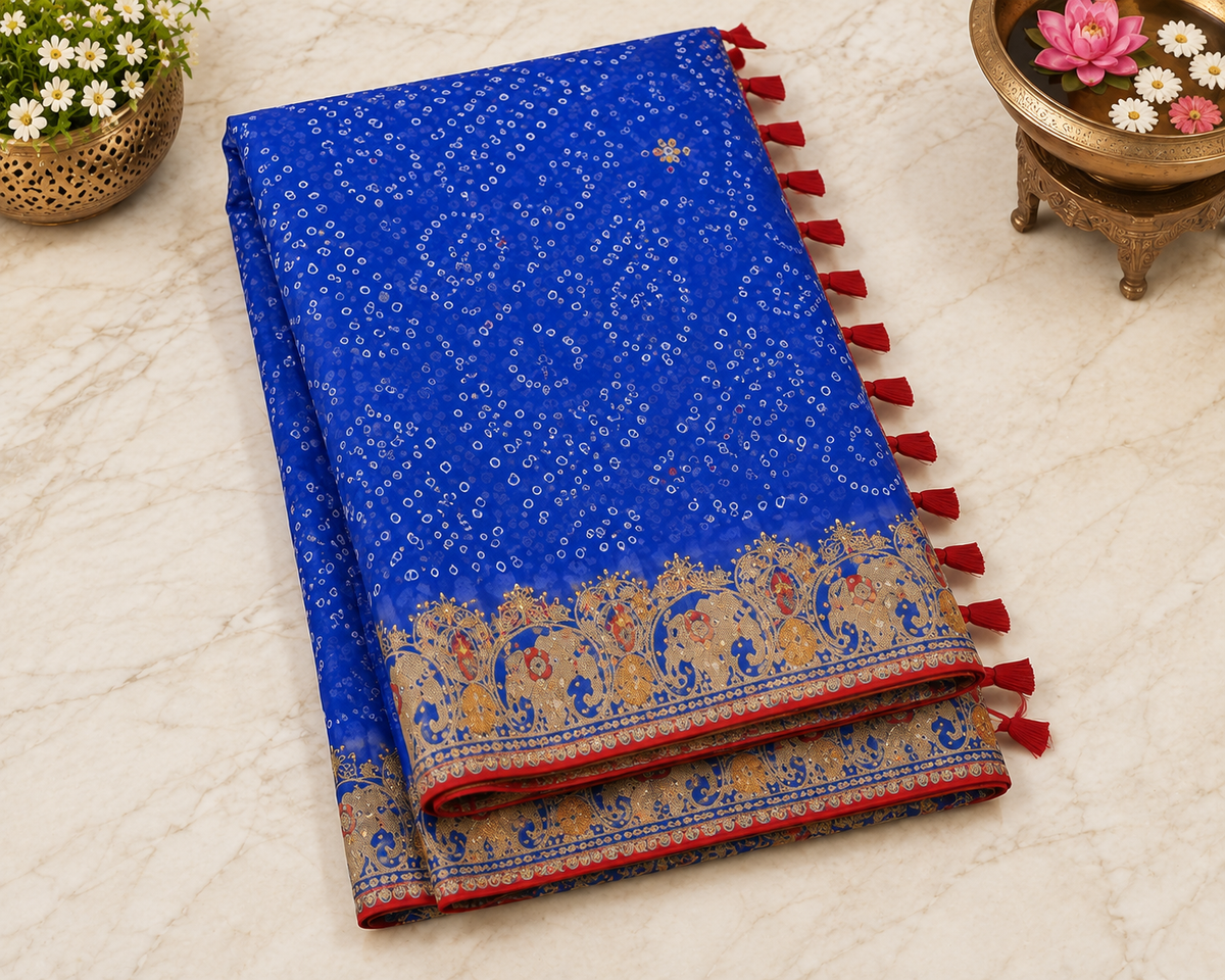 Royal blue bandhani georgette saree – folded view showing embroidered gold elephant border and red tassel edge