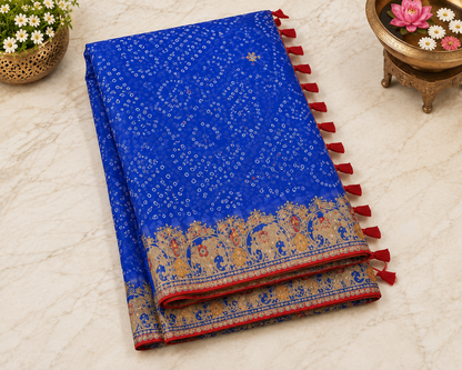 Royal blue bandhani georgette saree – folded view showing embroidered gold elephant border and red tassel edge