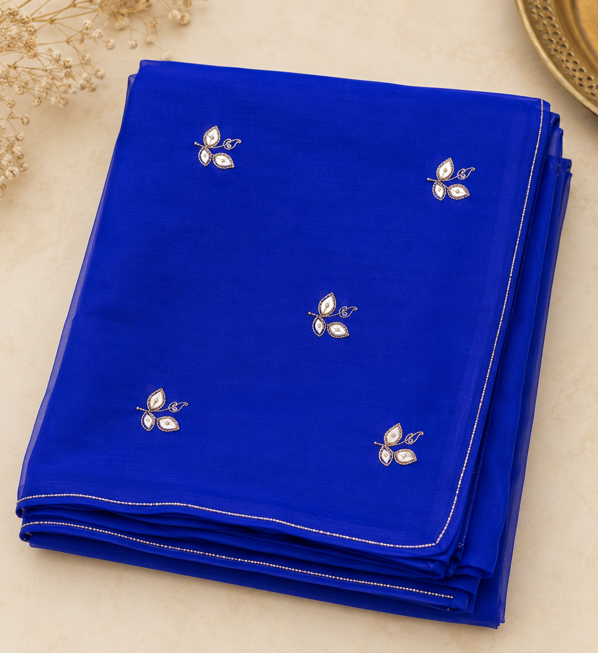 Najbeen royal blue chiffon darwari saree – folded view showing scattered kundan booti