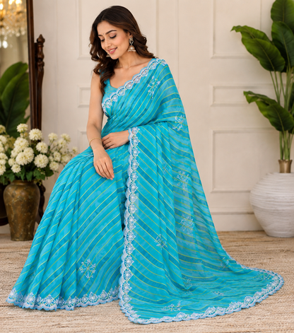 Sky blue lehariya georgette saree – model sitting view with matching blue blouse and scalloped lace detail
