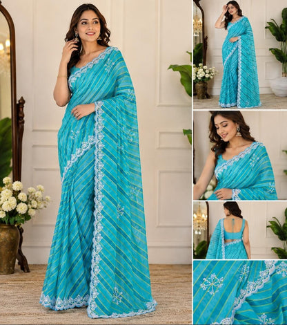Sky blue lehariya georgette saree – model wearing full drape with white scalloped lace border and snowflake motifs