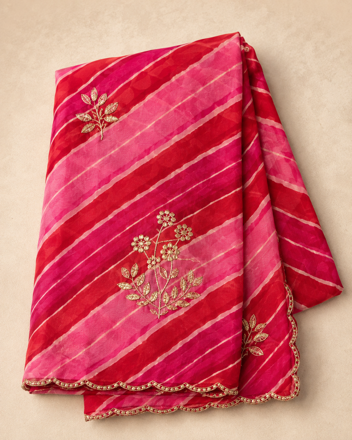 Pink and rani pink lehariya georgette saree - folded flat lay